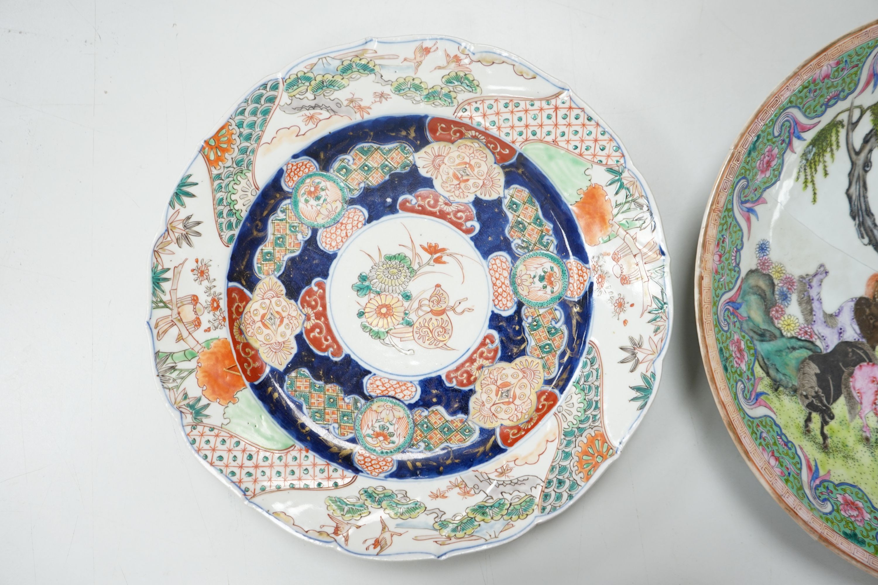 A 19th century Japanese Imari dish, 30cm and a damaged Chinese famille rose dish, 33.5cm 34cm